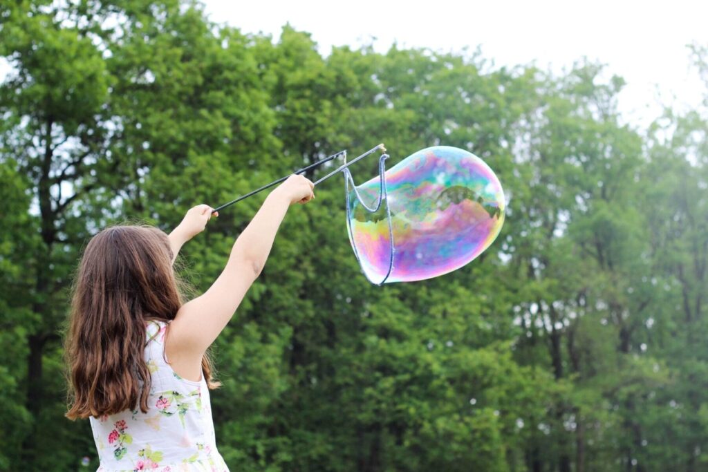 Girl playing with bubble