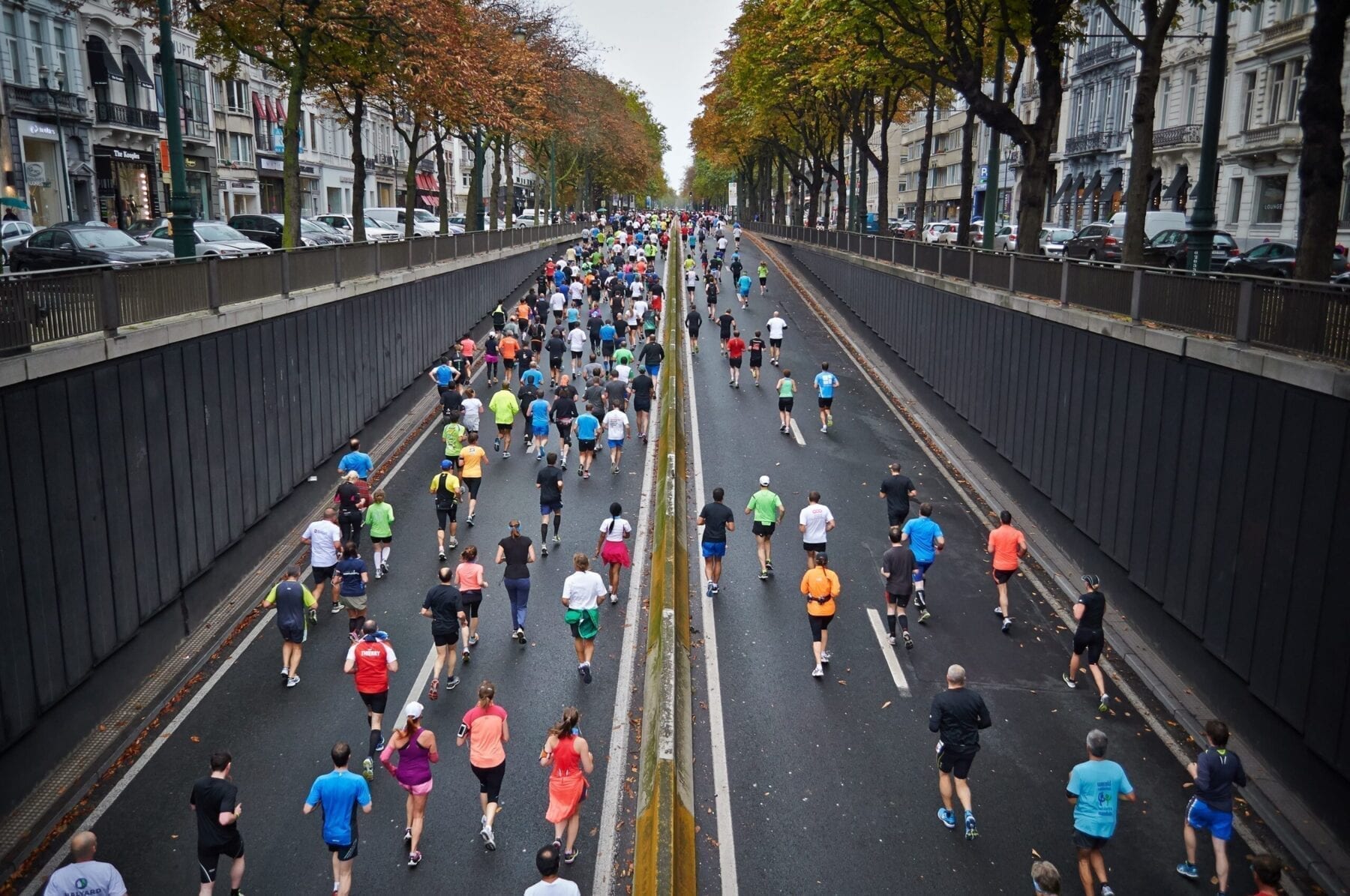 People running along street