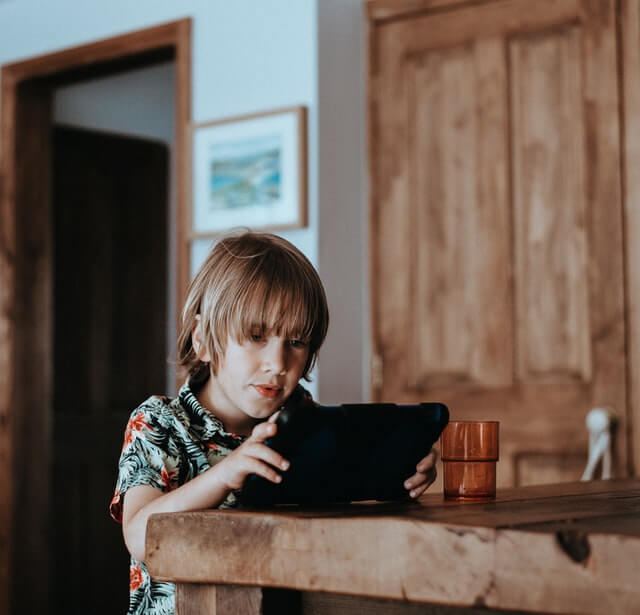 child with an iPad