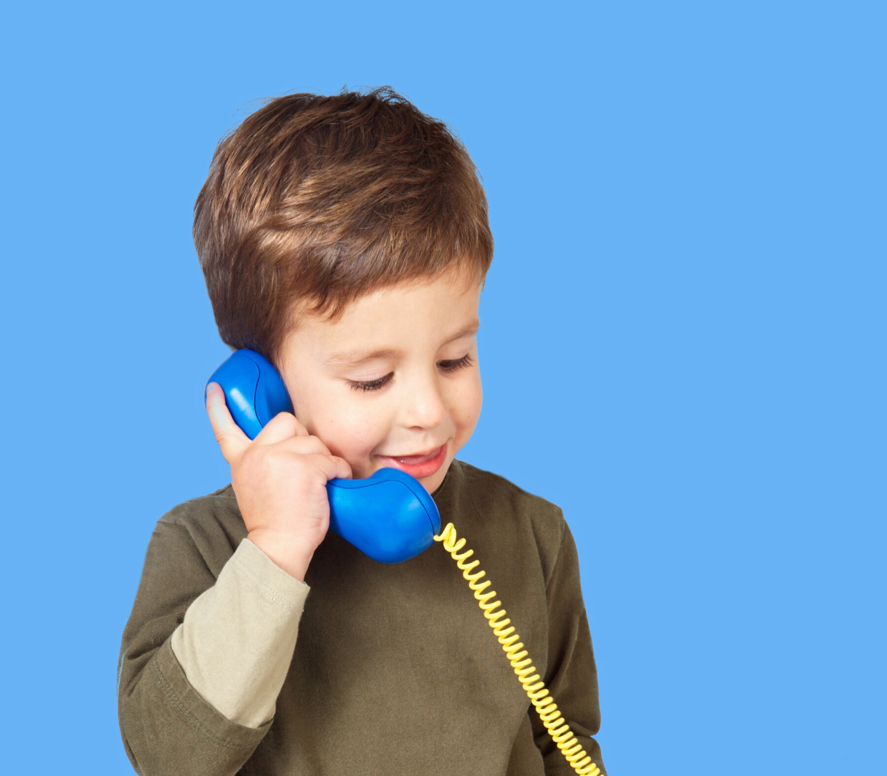 Adorable child talking on phone