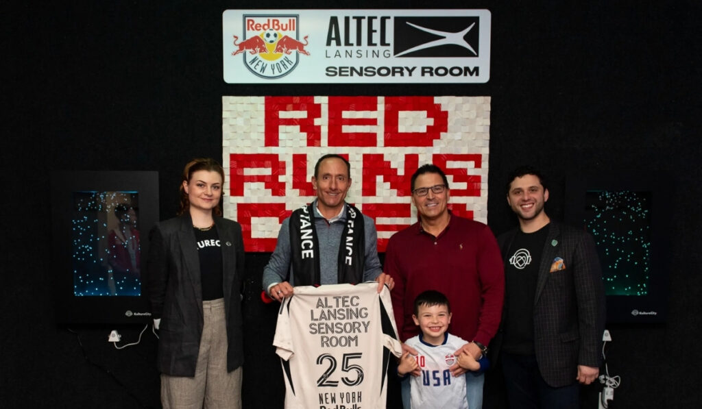 The New York Red Bulls have proudly unveiled an updated and enhanced sensory room at Sports Illustrated Stadium, further demonstrating their commitment to inclusivity and accessibility for all fans. The Altec Lansing Sensory Room, completed in partnership with the iconic speaker, headphone, and electronics brand, was thoughtfully designed with full input from KultureCity, the world’s leading nonprofit on sensory accessibility and acceptance. KultureCity has worked closely with sports teams and public venues across the country, ensuring that environments are supportive and welcoming to individuals with sensory processing needs. As the Official Audio Partner of the New York Red Bulls and Sports Illustrated Stadium, Altec Lansing has played a crucial role in the renovation. The audio electronics brand has outfitted the fully upgraded sensory room with cutting-edge noise-canceling headphones, including the Kid Safe 2-in-1 ANC and ComfortQ 2.0 models. These devices are specifically selected to help guests with sensory sensitivities enjoy a more comfortable, safe, and immersive experience while attending matches and other events held at the venue. The newly improved Altec Lansing Sensory Room officially opened to the public during a special event: New York’s Autism Acceptance match against Chicago Fire FC on April 5, 2025. The event served as the perfect opportunity to showcase the team's efforts to support fans with sensory needs. For their Autism Acceptance match, the Red Bulls made changes to their normal matchday experience to better accommodate fans on the autism spectrum, with sensory-friendly features like sensory sacks (including fidget toys and visual cue cards), lowered music volume, and an additional quiet zone on the plaza level at Sports Illustrated Stadium. In addition to these thoughtful matchday adjustments, the Red Bulls have made it easy for families and individuals to take advantage of the new sensory room. "To gain access to the Altec Lansing Sensory Room, families and fans do not need a special ticket to the games. All fans need to do is approach Fan Services at a Red Bulls match and they will assist you to reach the Altec Lansing Sensory Room on the 5th Floor." The Red Bulls were among the first teams in Major League Soccer to open a permanent sensory room, originally launching the space in 2017. Since then, they have continued to expand their efforts to be a more inclusive organization for neurodivergent individuals and families. The 2025 enhancements reflect not only a technological upgrade, but a reaffirmation of the team’s values around diversity, inclusion, and community support. Through their collaboration with Altec Lansing and KultureCity, the Red Bulls continue to lead by example in creating an accessible game day experience that prioritizes the well-being of every fan. Whether it’s your first match or your fiftieth, the Red Bulls want every guest to feel seen, supported, and safe inside Sports Illustrated Stadium. Start Your Child’s Journey Toward Meaningful Growth Today Helping your child reach their full potential takes patience, support, and expert care. That’s why families trust Golden Care Therapy to provide personalized solutions through ABA therapy in New York. Our experienced team works one-on-one with children, focusing on communication, social skills, and reducing challenging behaviors—all in a nurturing environment. We tailor each treatment plan to meet your child’s unique needs and progress. Whether at home, school, or in the community, we’re here to guide you every step of the way. Let’s take the next step together—because every child deserves the best start in life. Contact us today to learn more.