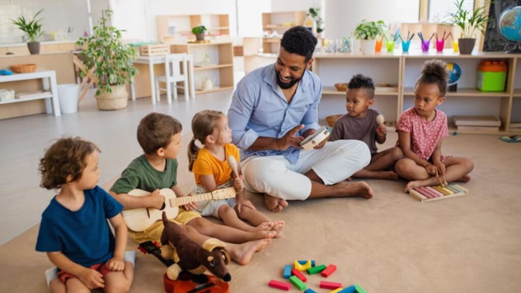 Children with autism and ADHD cooperate with their instructor in a sunlit classroom, sitting together on the floor and engaging in the lesson.