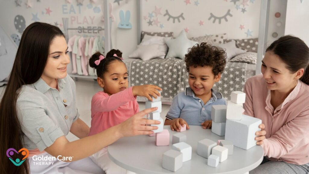 a woman and children playing with blocks